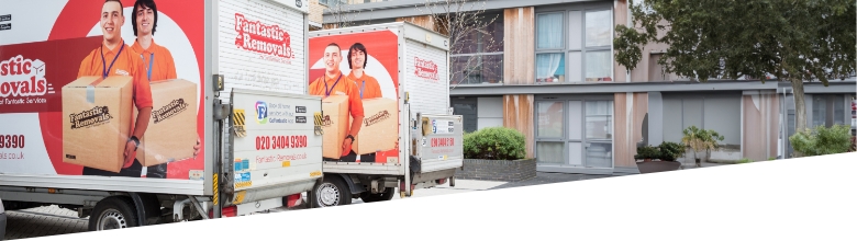 The image shows a branded Fantastic Removals van that is parked on the street, being loaded with household belongings.