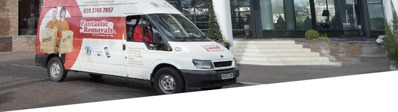 The image shows a mover wearing a Fantastic Removals uniform who is standing next to a branded van.