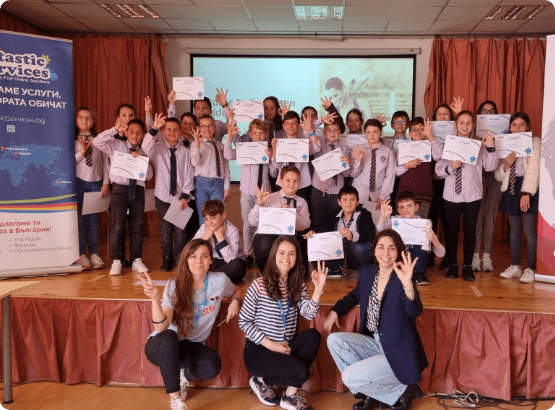 Group of kids holding certificates, celebrating academic achievement.